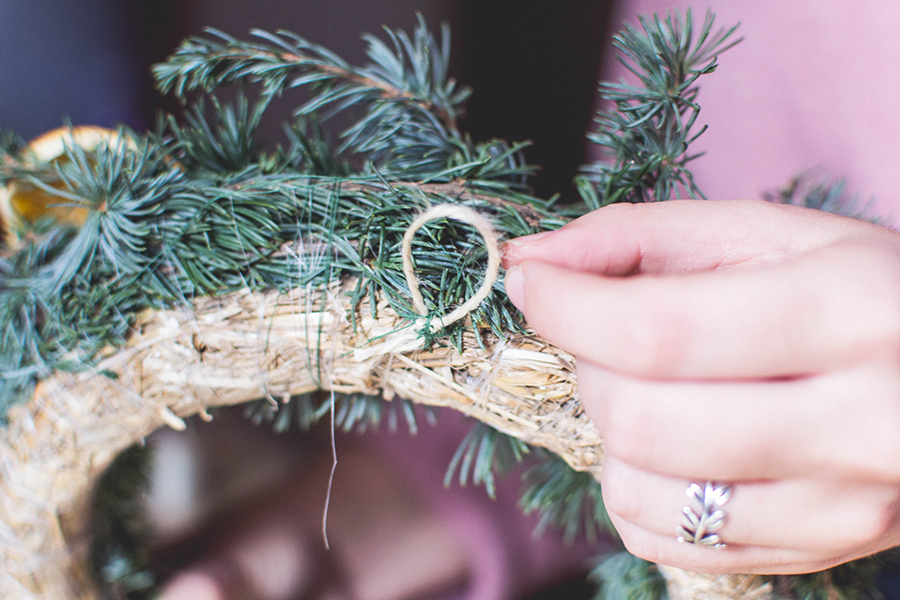 Create a hanging loop in your DIY natural Christmas wreath