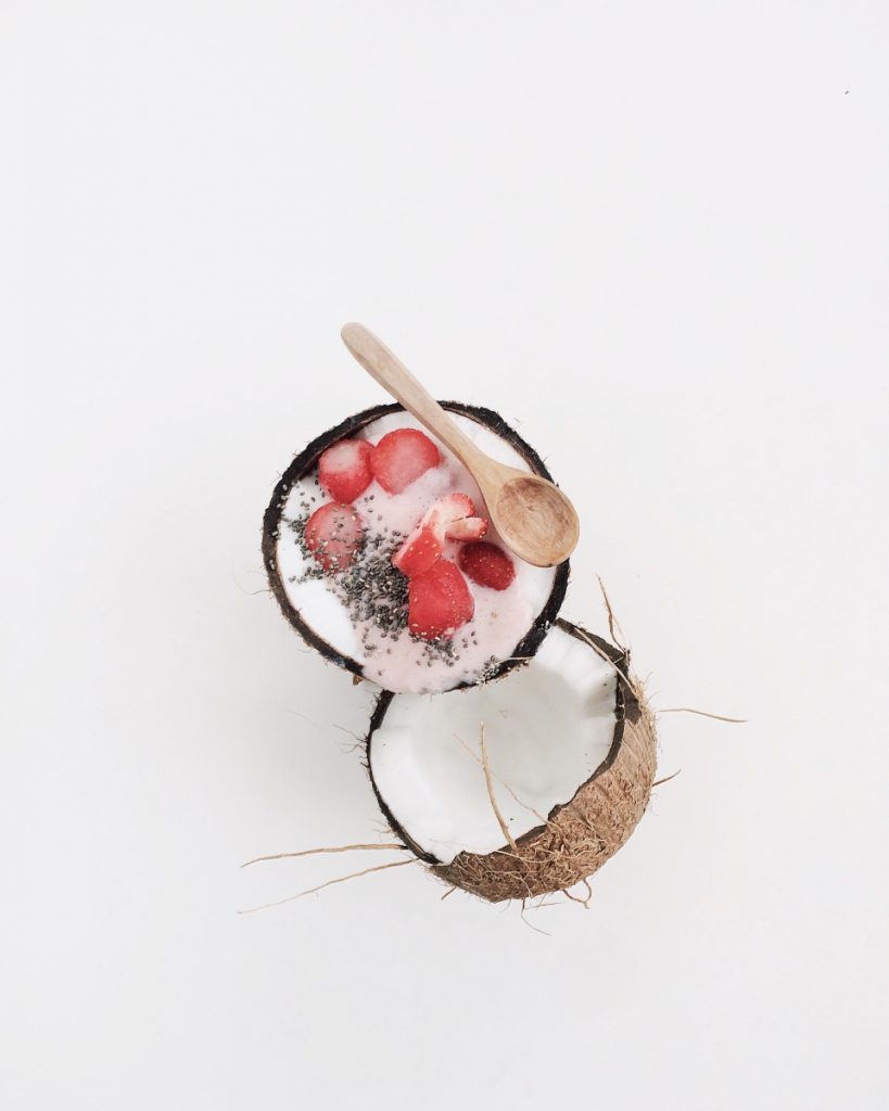 strawberry coconut chia seed pudding recipe in a coconut shell