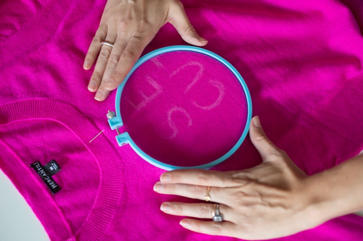 stretch the fabric to create embroidered letters on a sweater