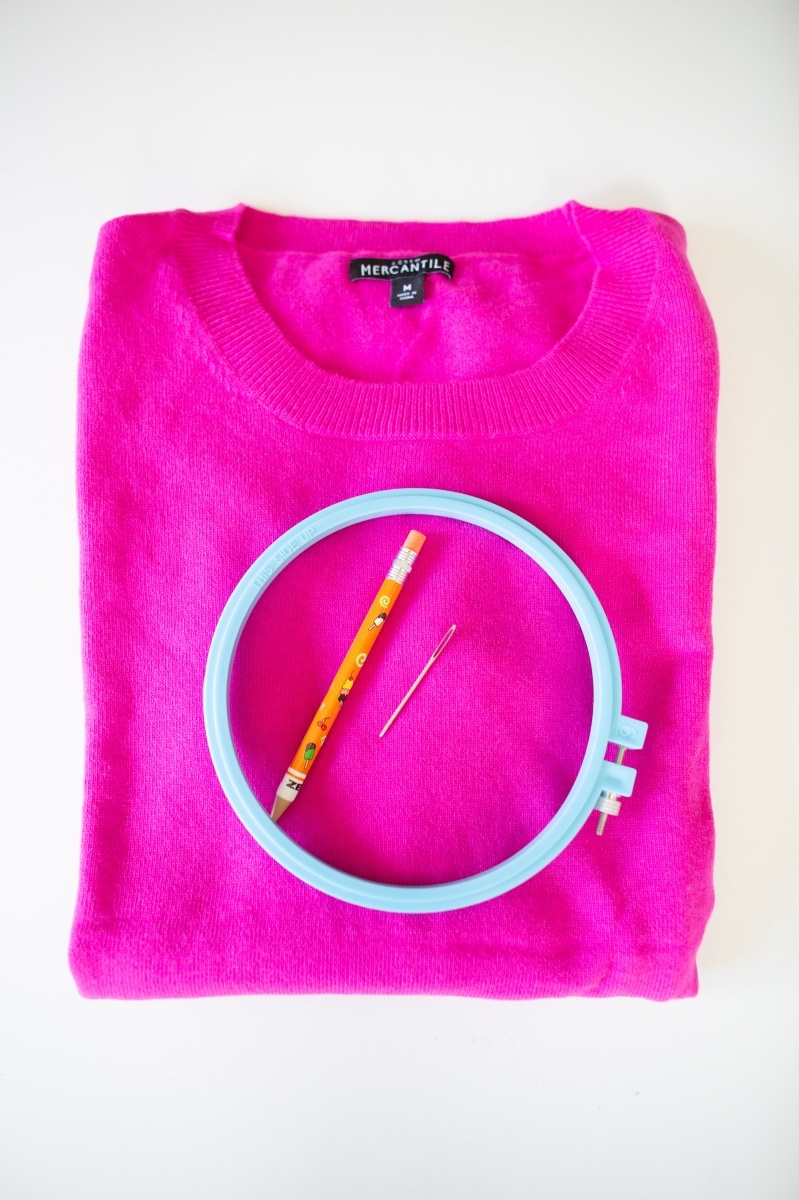sweater and embroidery hoop supplies to make an embroidered sweater