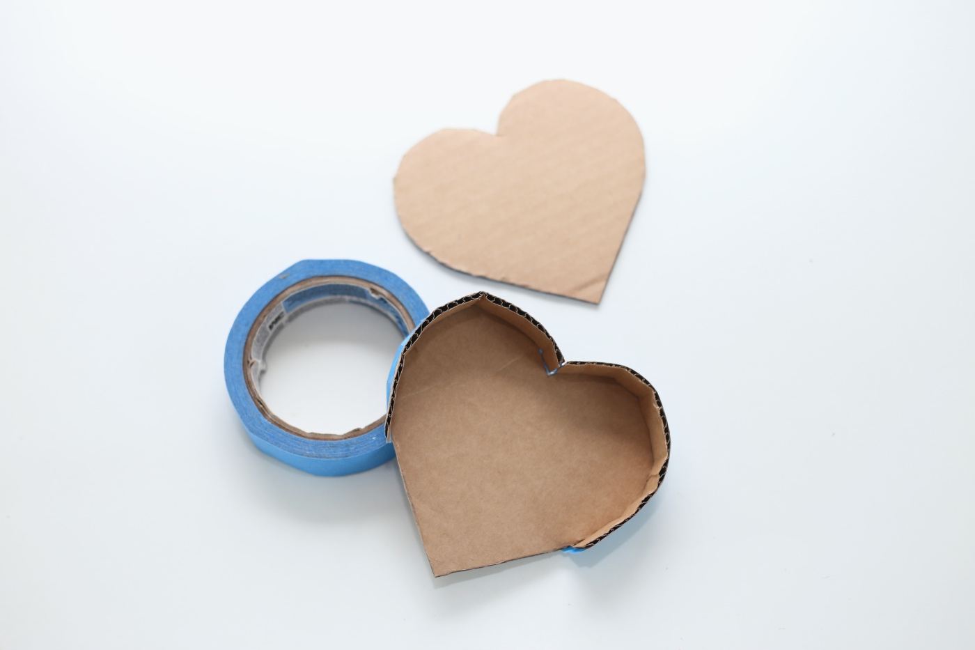 cardboard and tape to make a diy heart shaped pinata pop shop america
