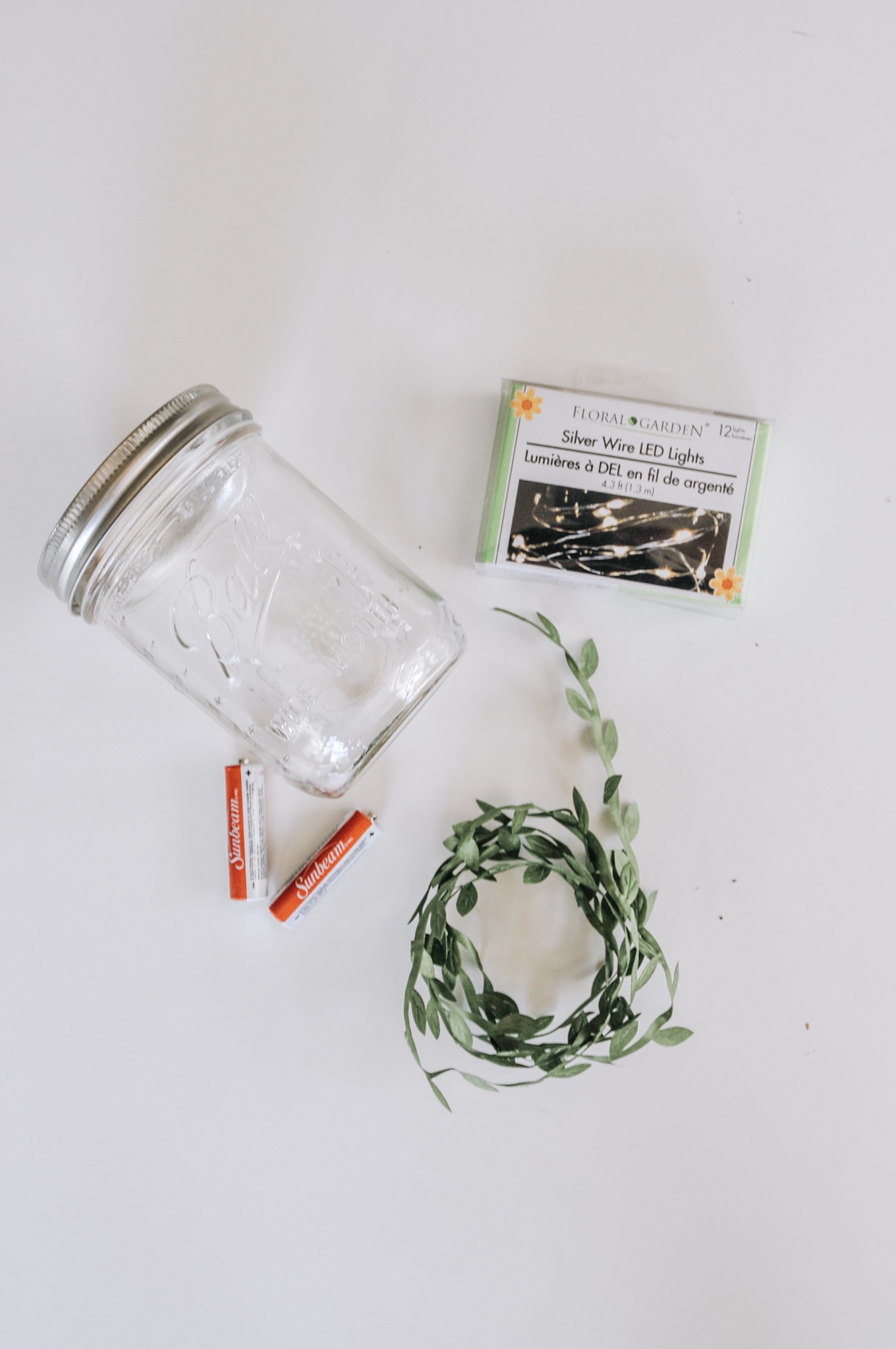 supplies to make a mason jar light diy with green ivy