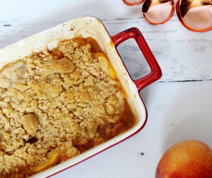 Angled Peach Vanilla Bourbon Crumble with Peach and Spoons