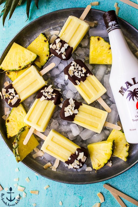 chocolate dipped pina colada popsicle with alcohol