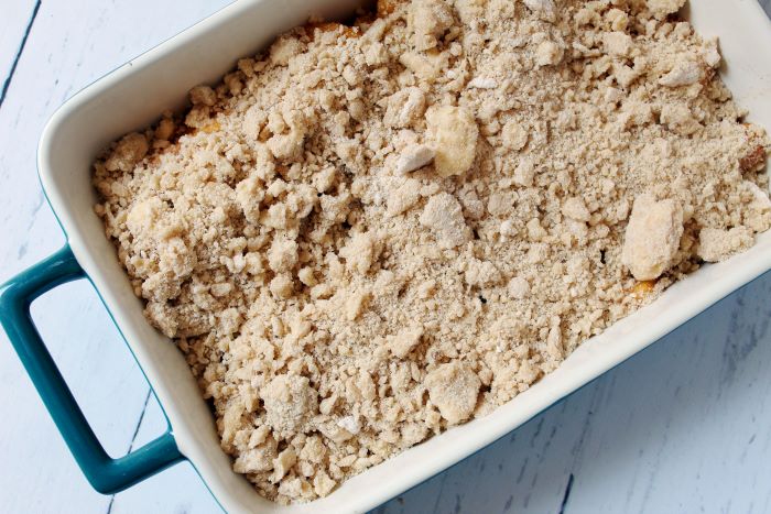 unbaked pan of peach crumble
