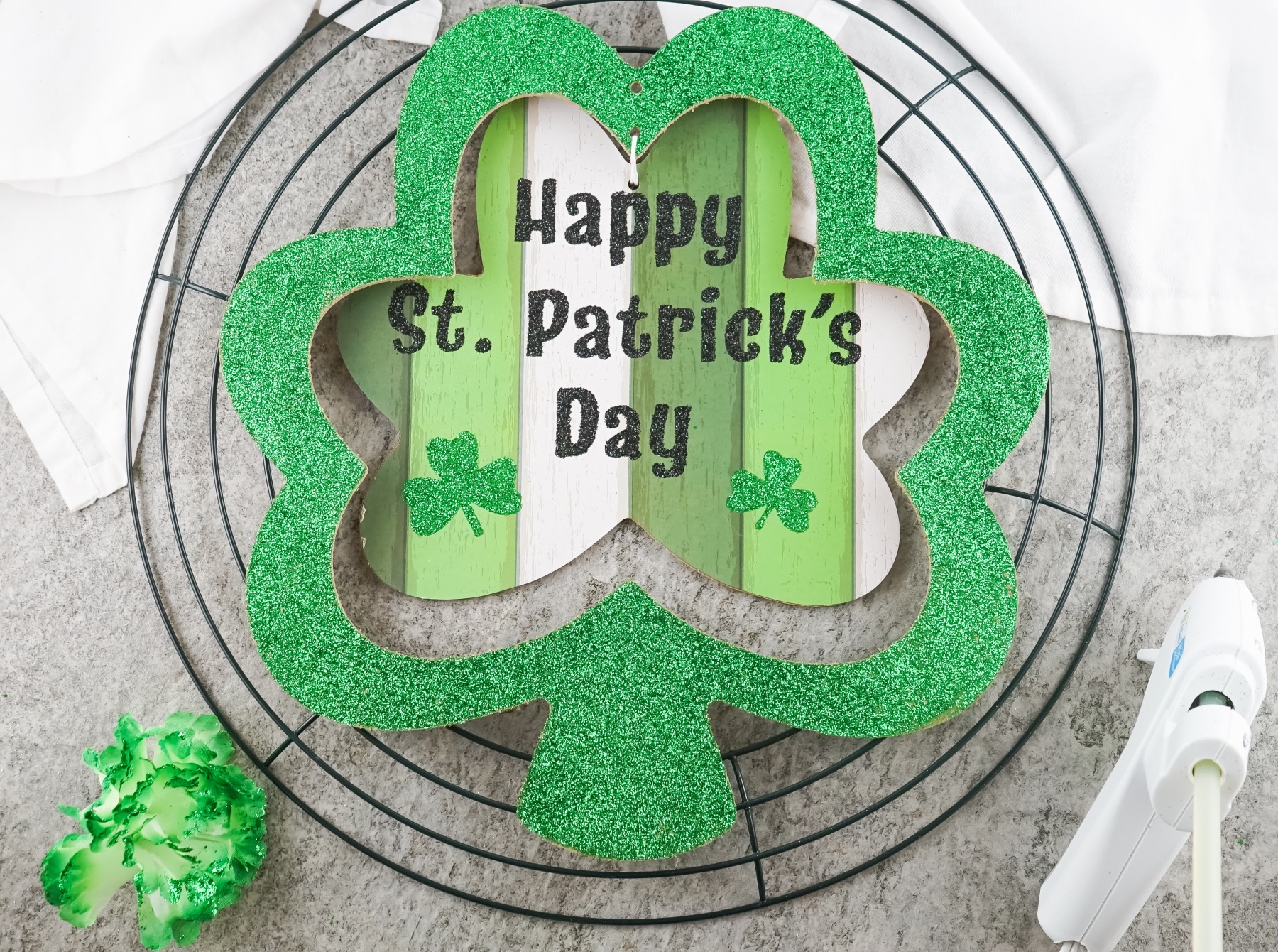 place the shamrock in the center of the wreath base