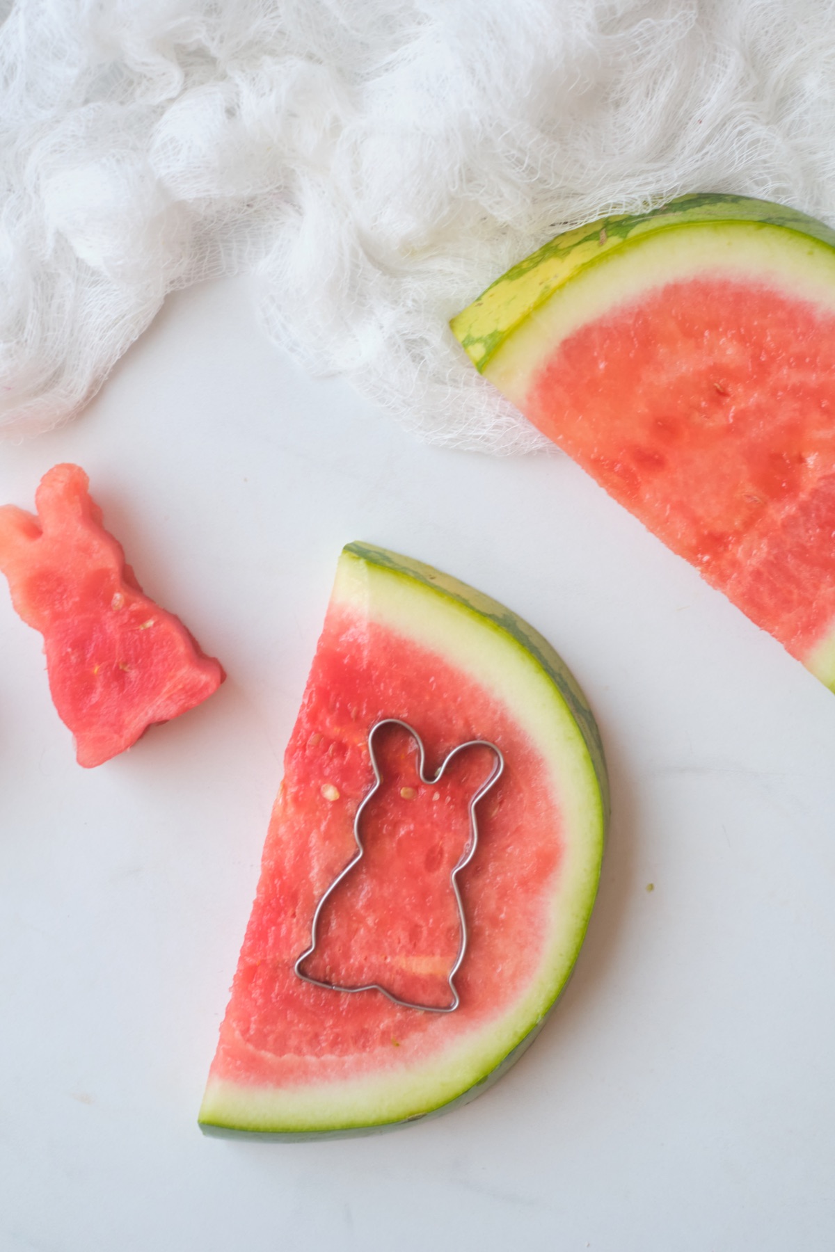 punch the watermelon with a bunny cookie cutter