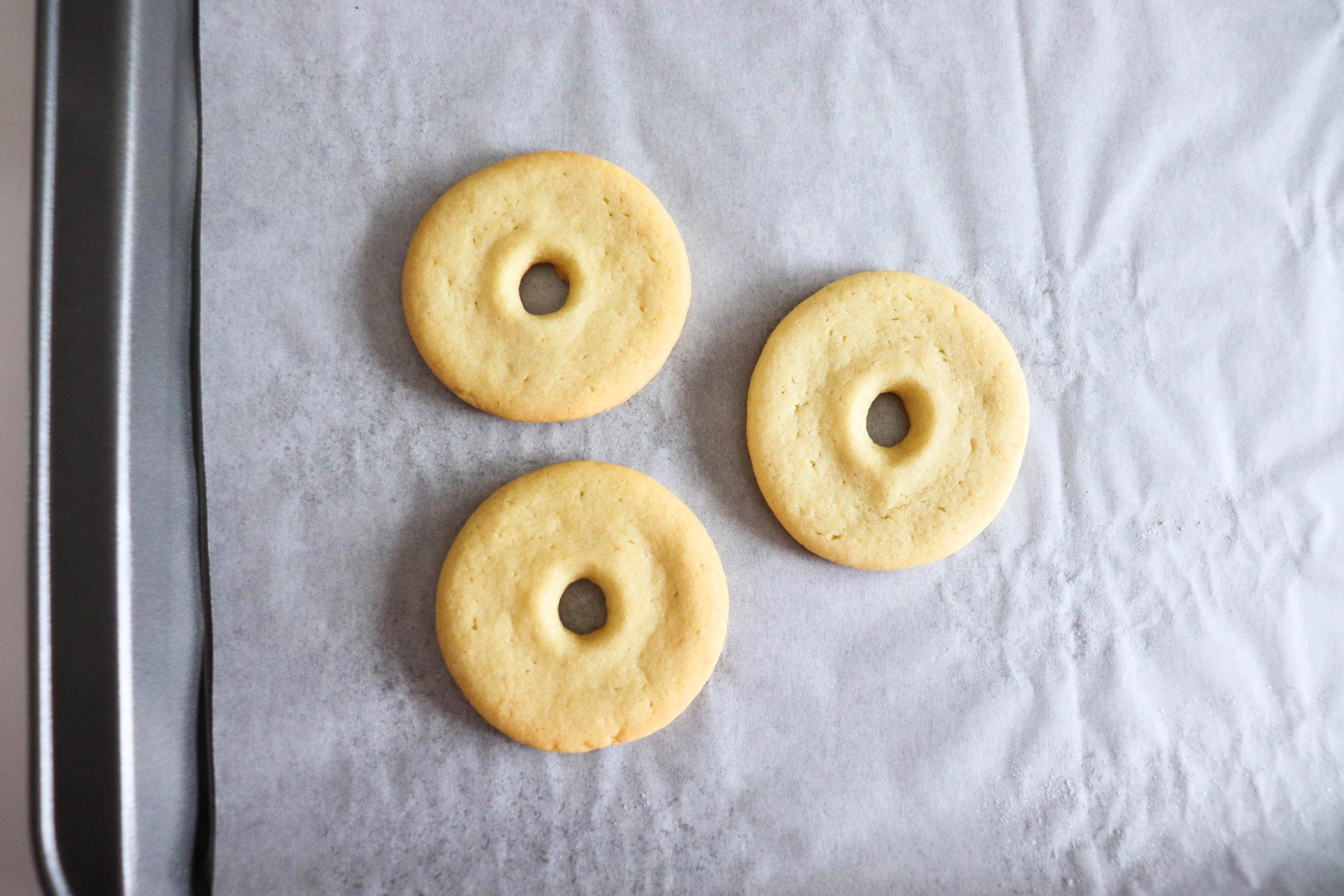 baking the donut shaped sugar cookies