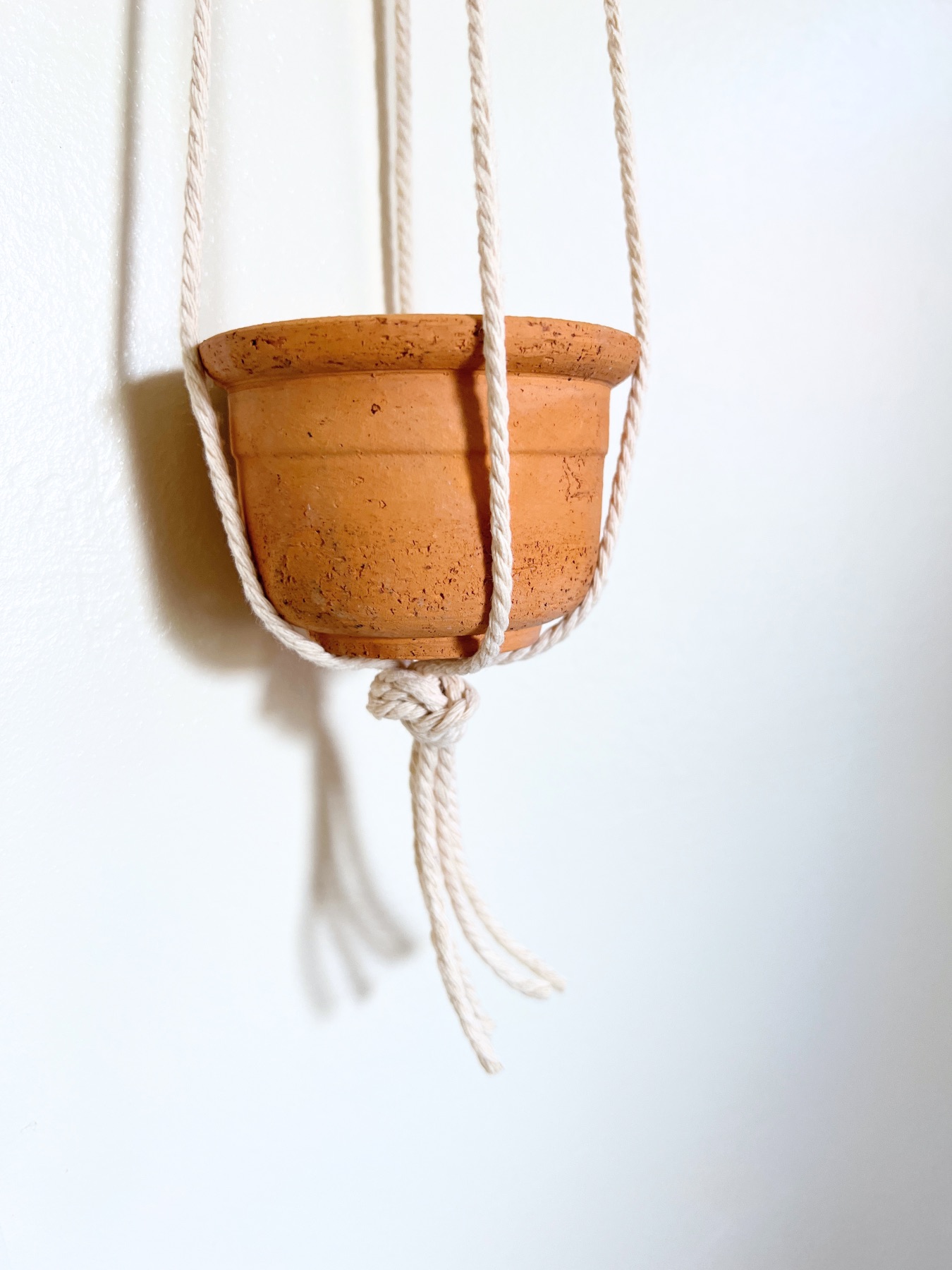 finished macrame hanging planter ready for plants