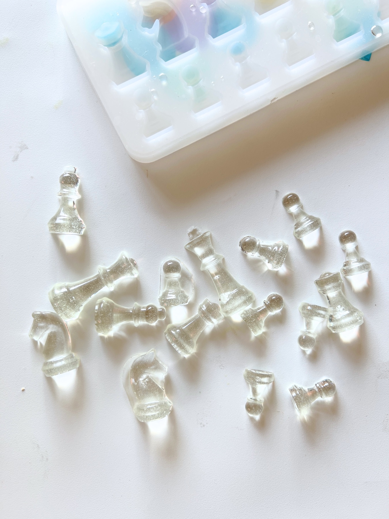 clear chess pieces removed from the mold
