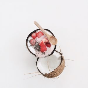 strawberry coconut chia seed pudding recipe in a coconut shell