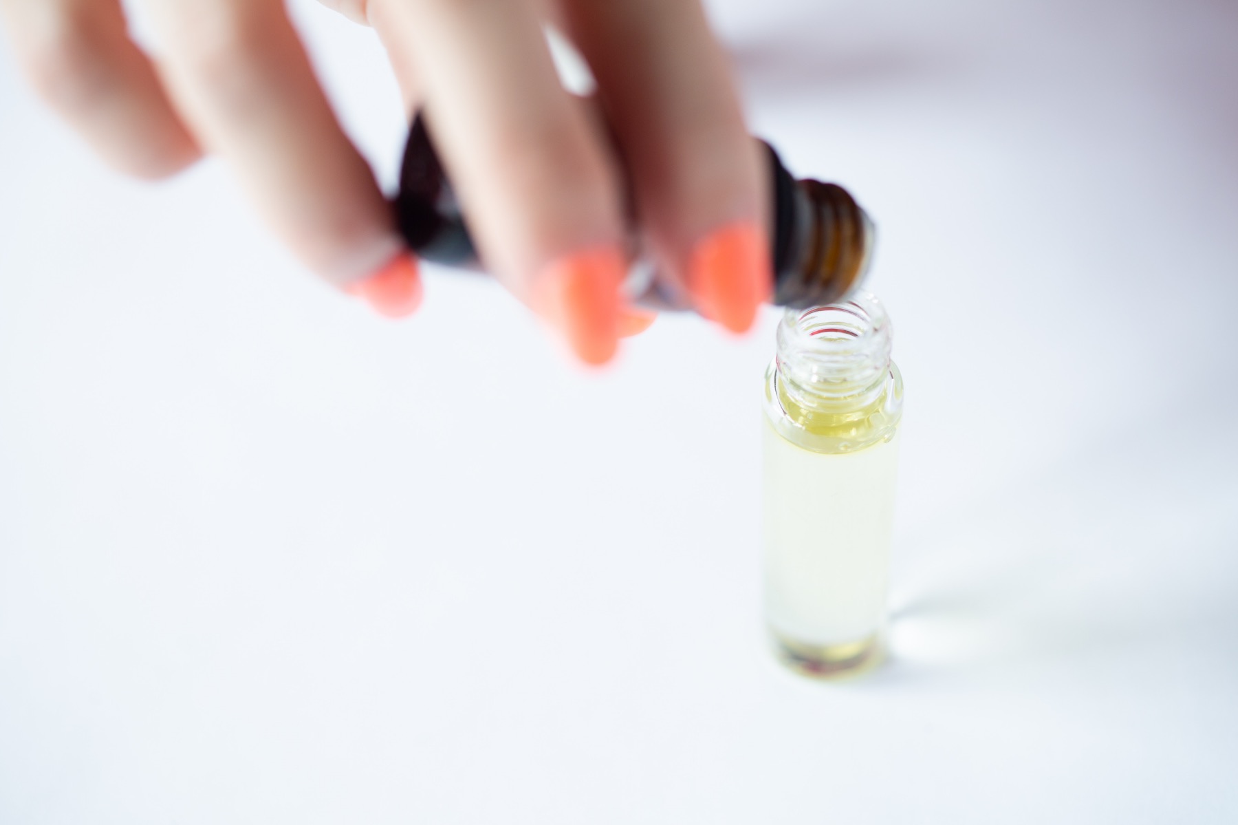 drop the essential oils into the roller ball