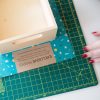 add-paper-behind-the-wooden-box-with-mod-podge_square