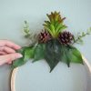 placing-the-leaves-and-plants-pop-shop-america-wreath-diy_square