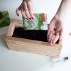 plant-herb-seeds-to-the-diy-wood-planter-box-pop-shop-america_square