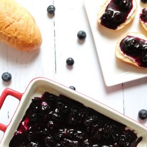 blueberry-goat-cheese-dip-on-baguette-and-in-pan-with-bread-square