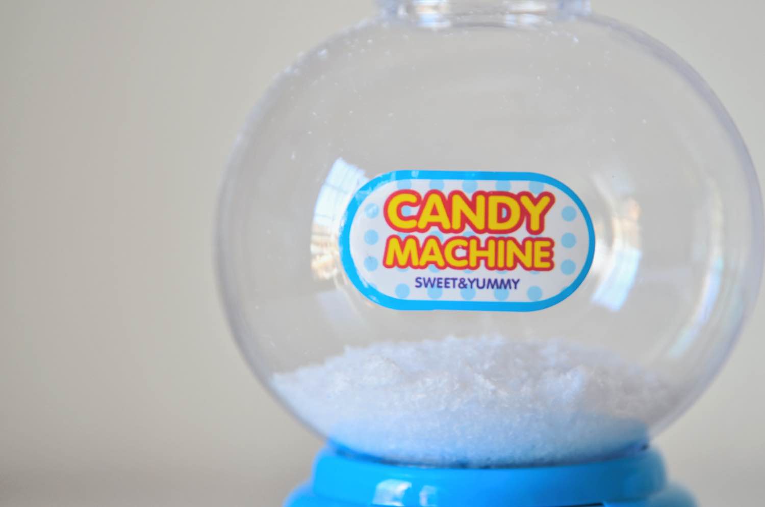 add faux snow to a gumball machine snow globe