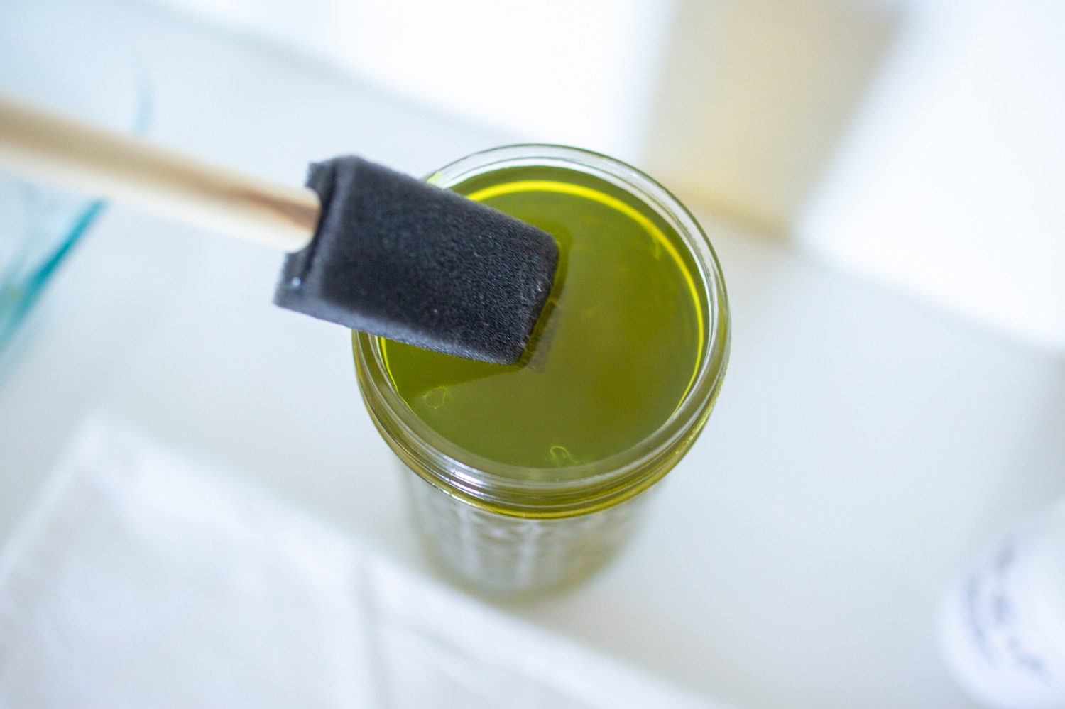 use a brush to apply cyanotype liquid to fabric