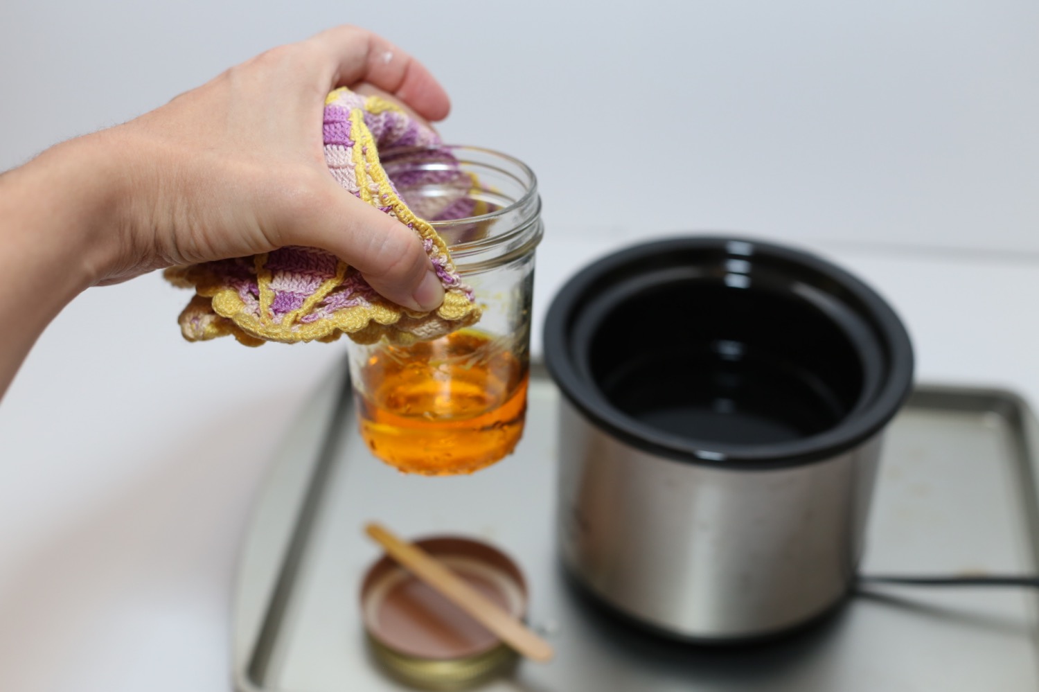 remove the mason jar and wax from the heat
