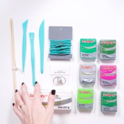 flatlay of cactus clay ring holder supplies