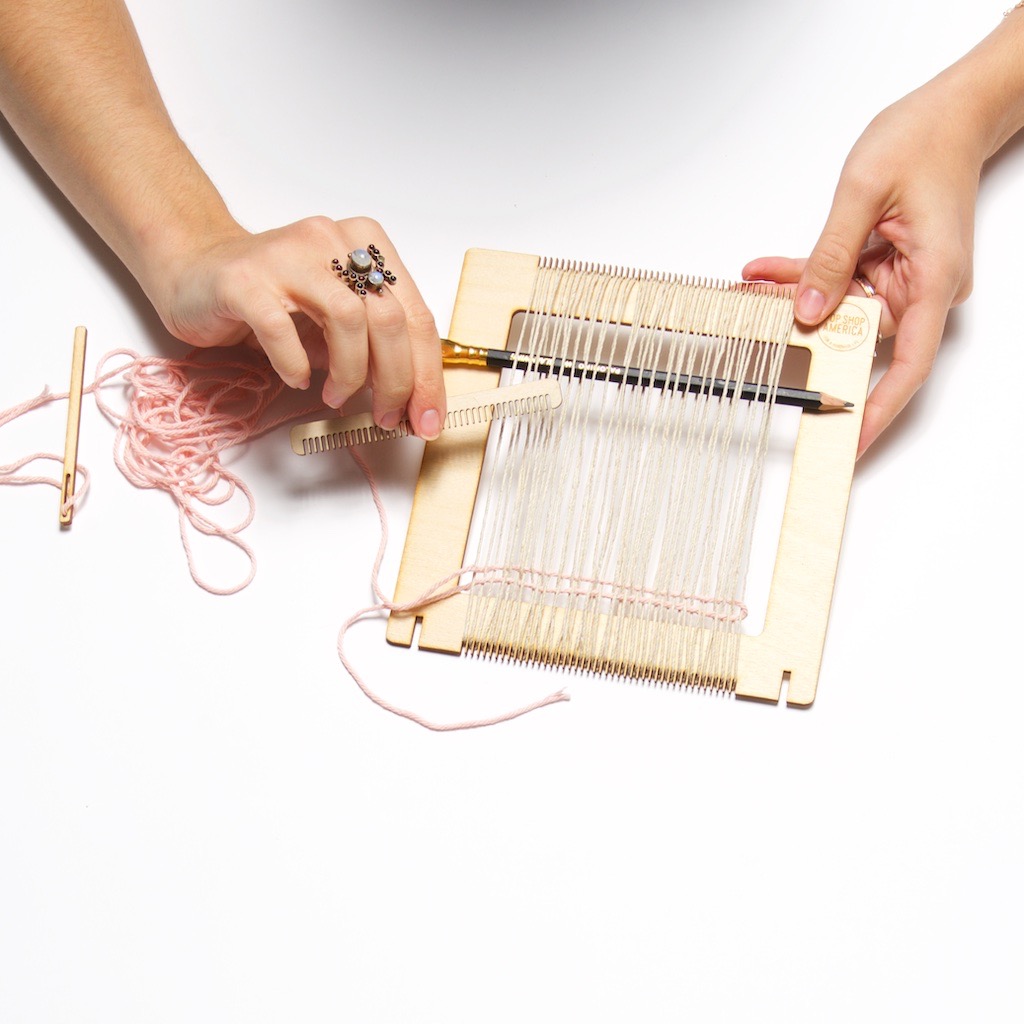 how to comb the yarn into place in a loom weaving project