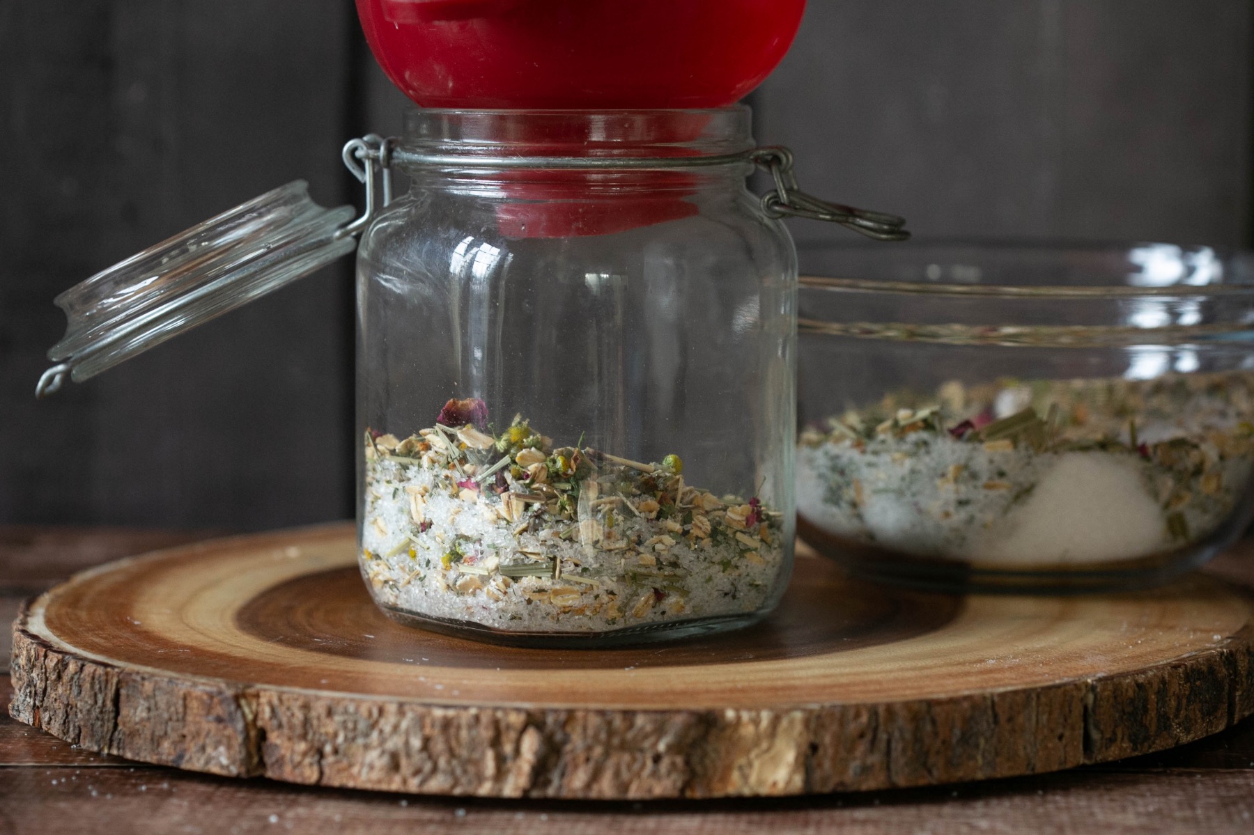 pour forest bath soaks ingredients into a glass jar