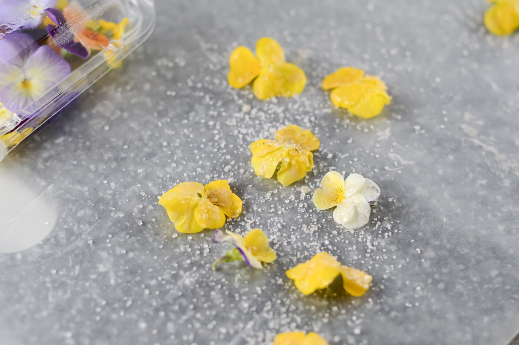 lay the flowers on parchment to make candied flowers