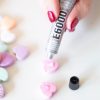 add-the-glue-to-the-conversation-heart-to-make-diy-candy-earrings_square