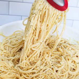 lemon garlic parmesan pasta being lifted out of skillet 1