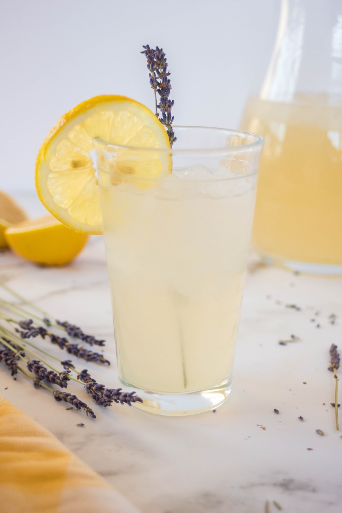 serve lavender lemonade over ice with a sprig of herbs
