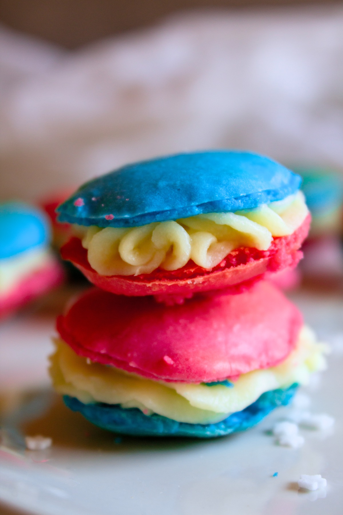 close up of finished red, white, and blue macarons