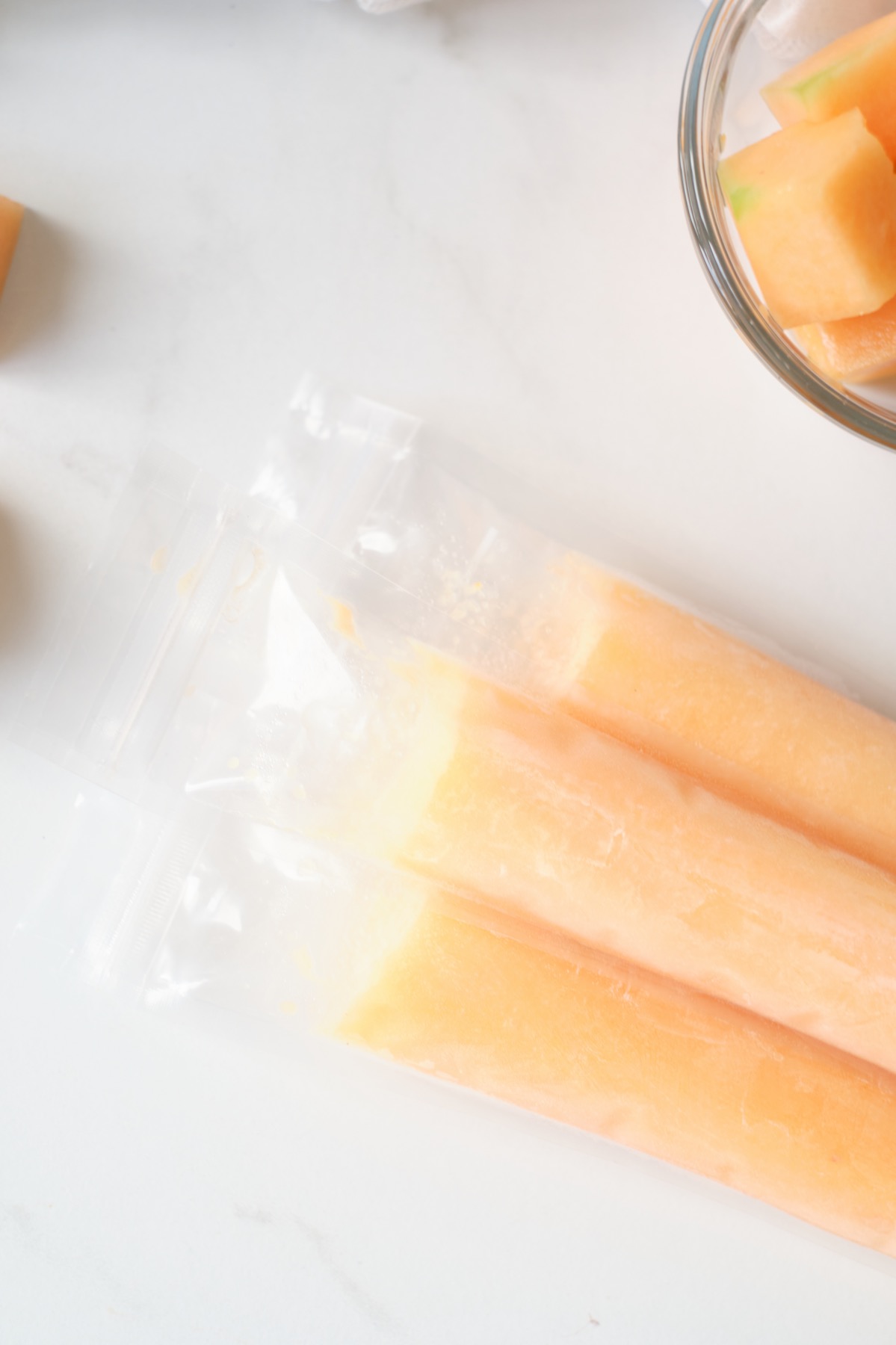 https://popshopamerica.com/wp-content/uploads/2021/07/close-up-of-cantaloupe-popsicles-recipe-pop-shop-america.jpg