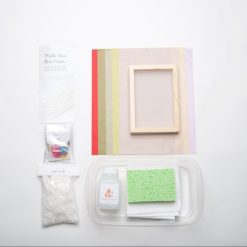 flatlay of supplies inside the diy paper making craft kit square