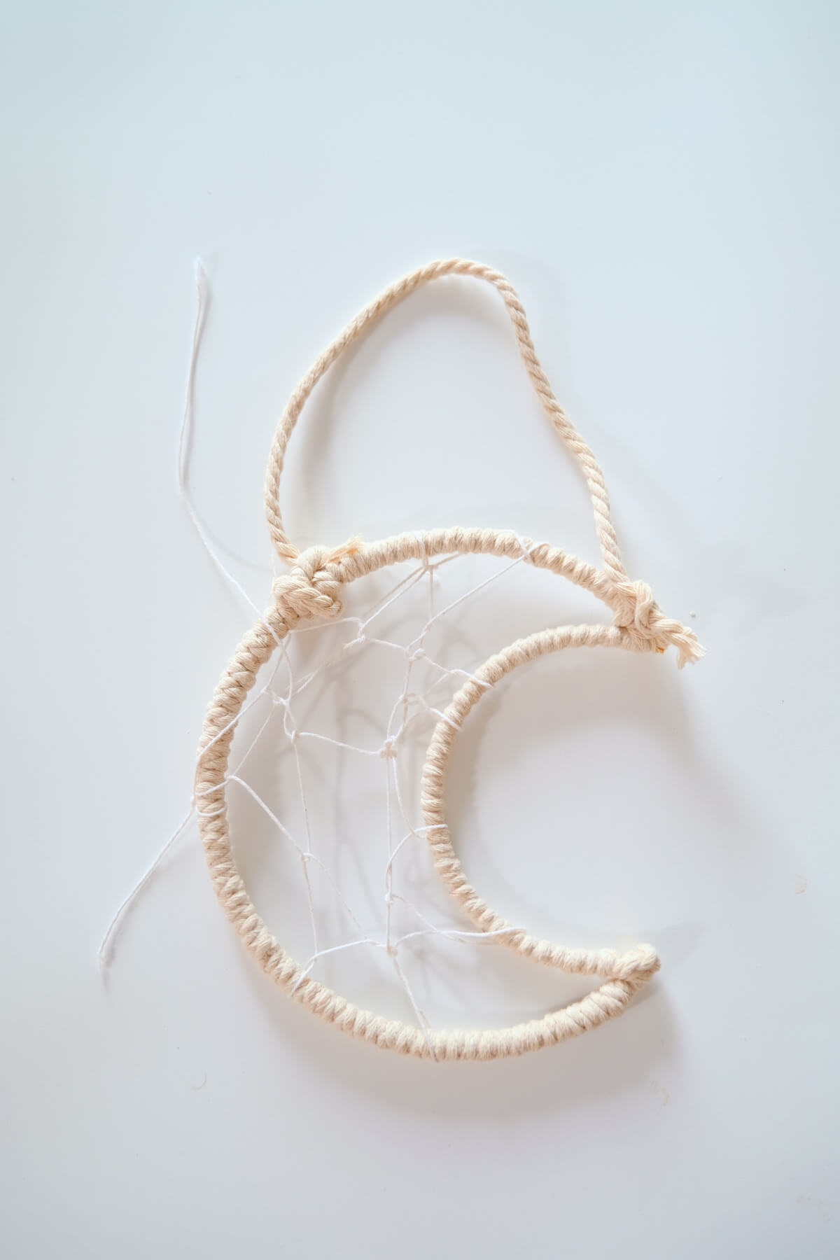 wrap the interior of the macrame moon wall hanging