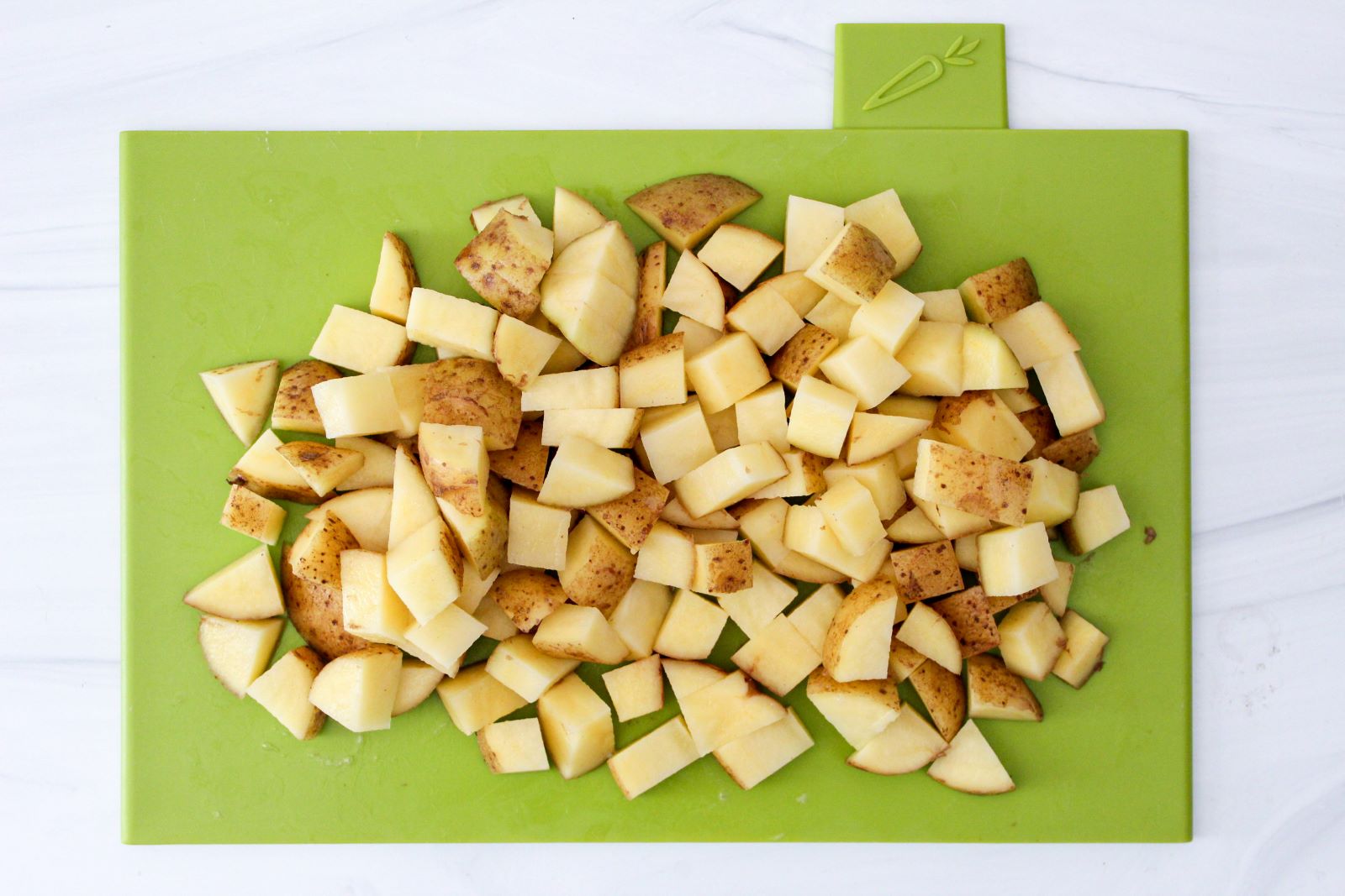 Potatoes diced on cutting board 1