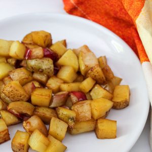 honey chipotle roasted potatoes and apples on vertical plate 1