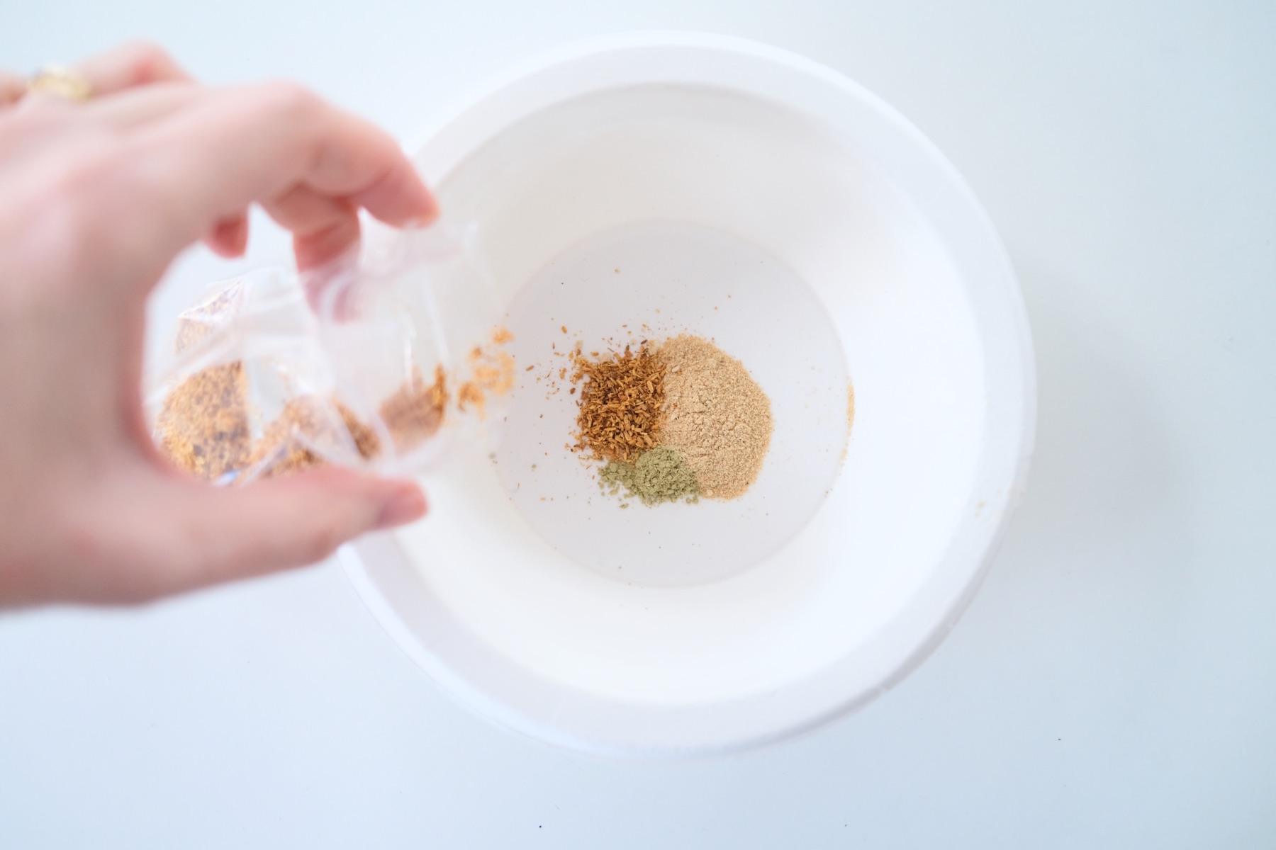 add palo santo to the bowl of other powdered herbs
