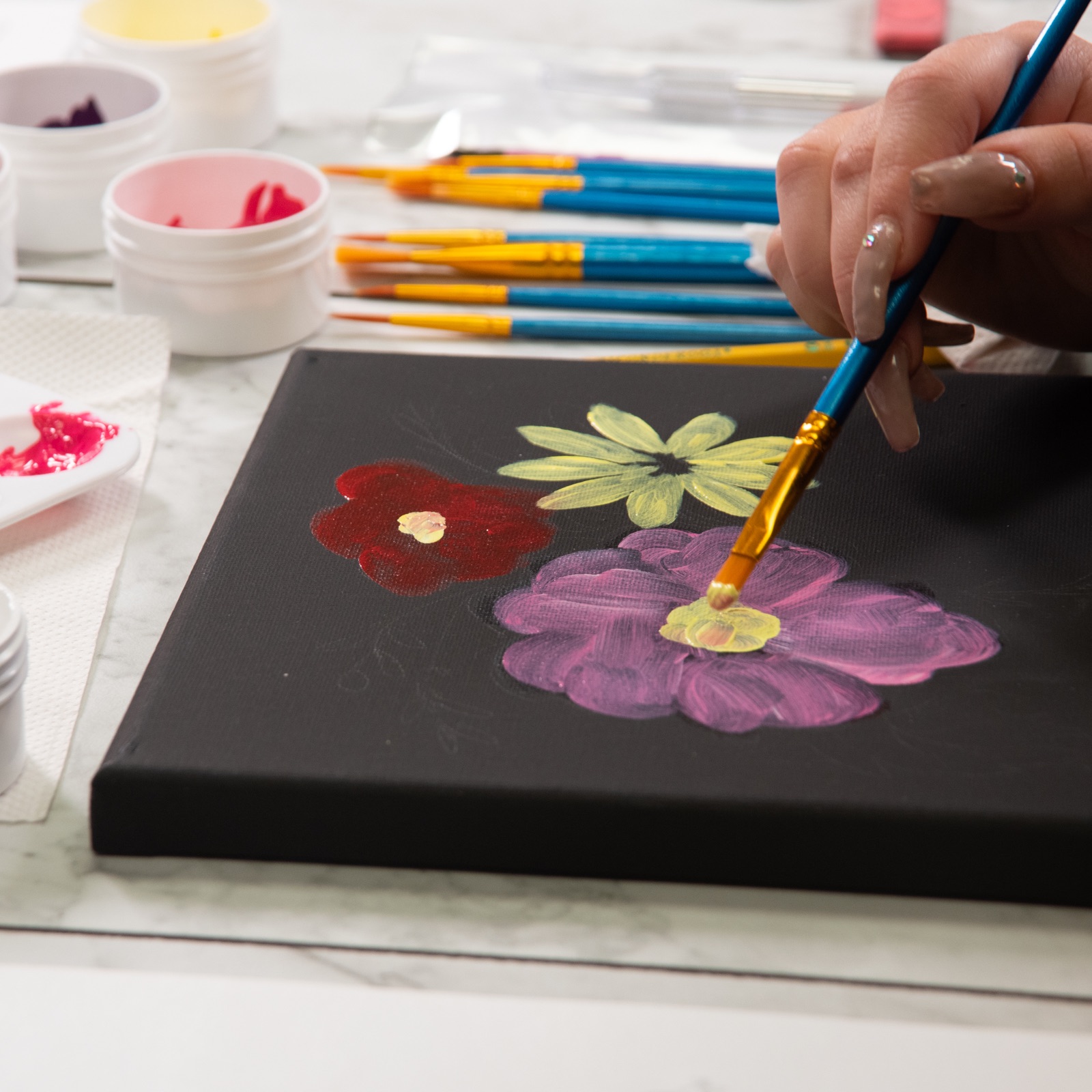 black canvas painting of flowers tutorial