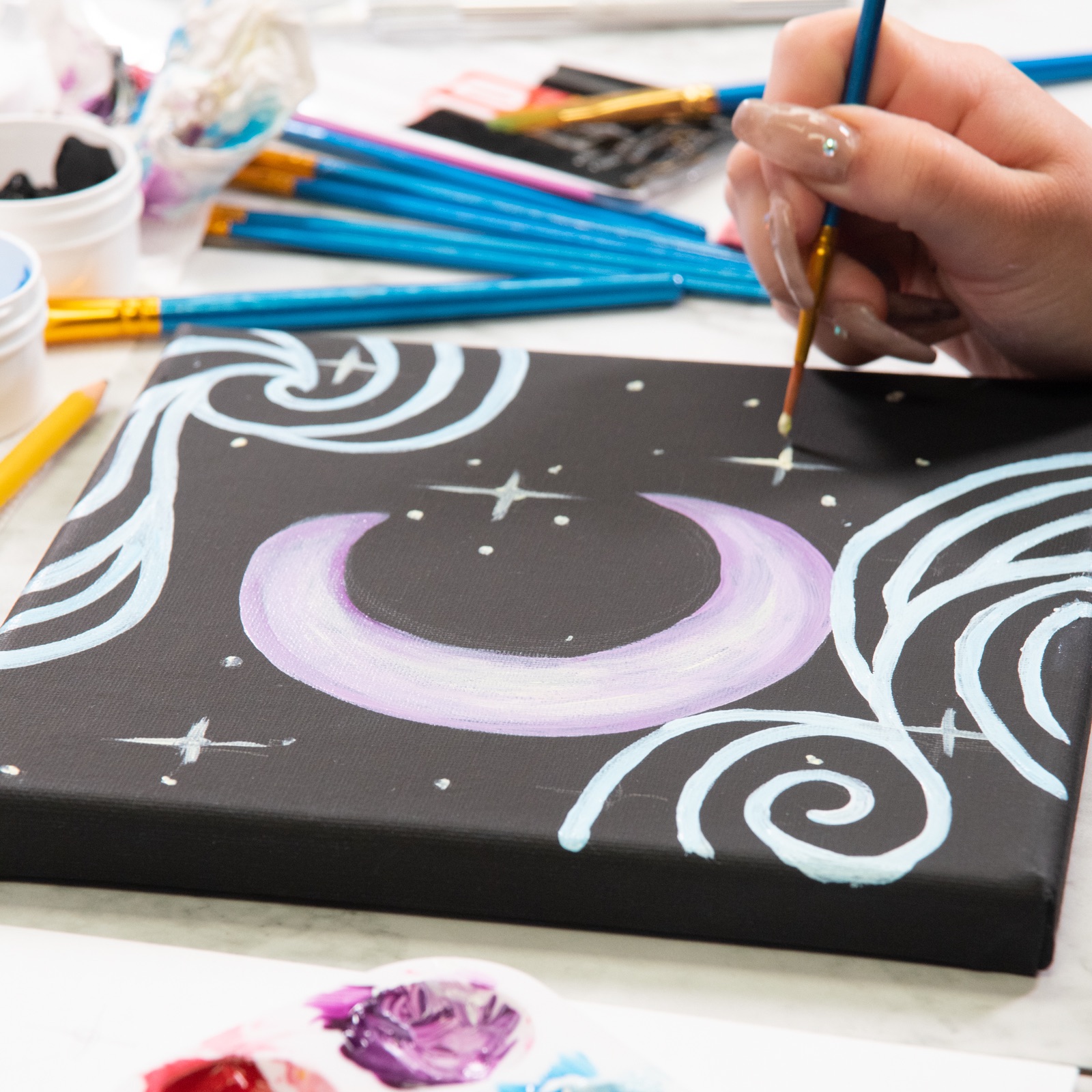 paint finishing touches on your moon and stars