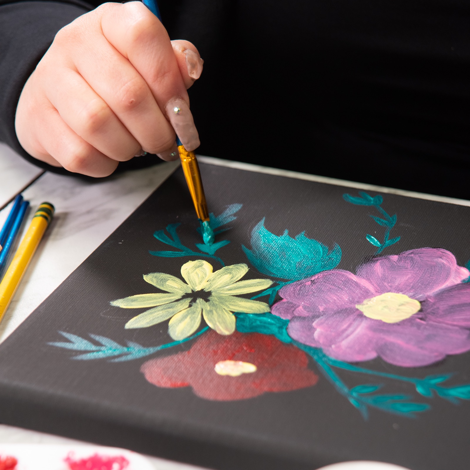 painting the leaves of the flowers