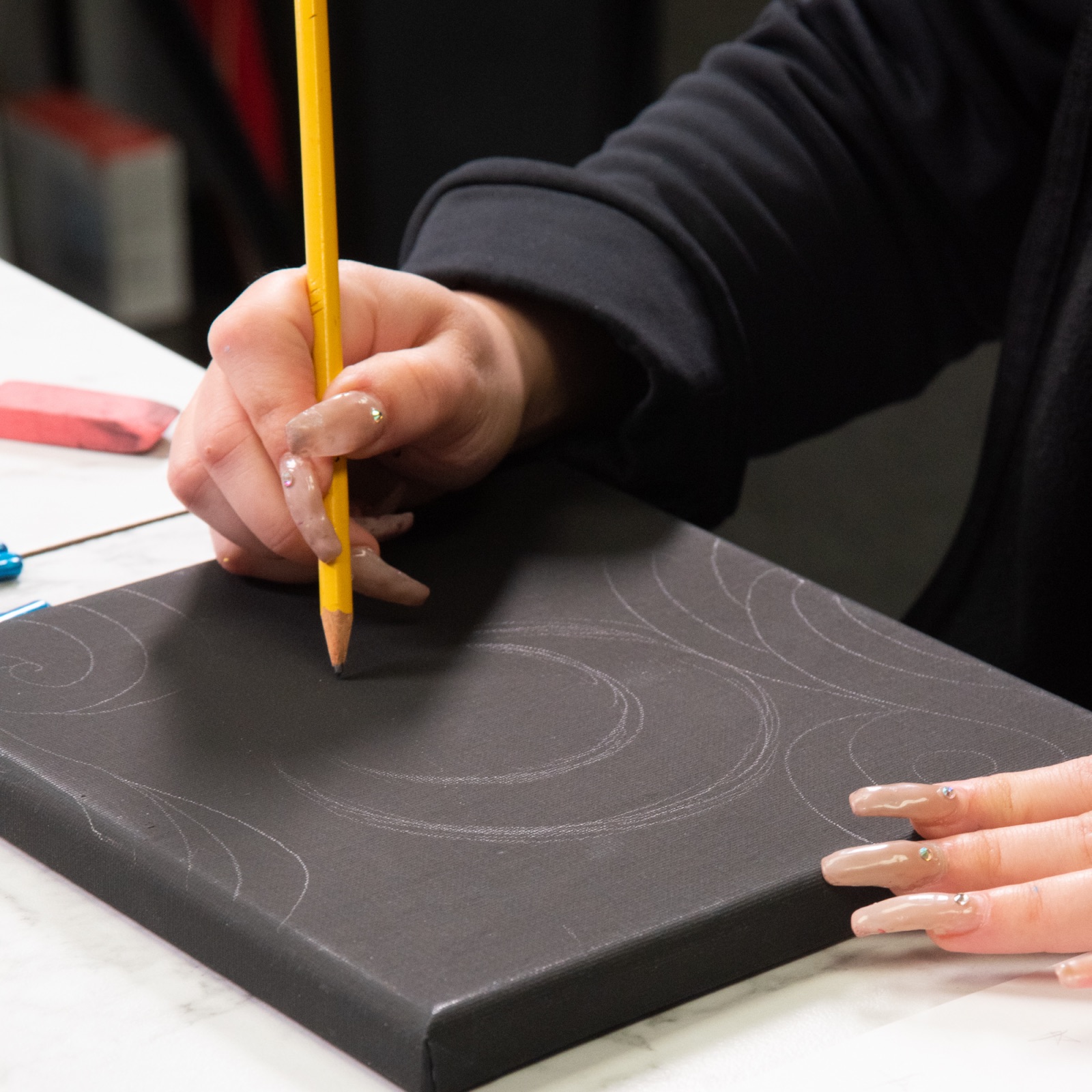 sketch a moon on the black canvas