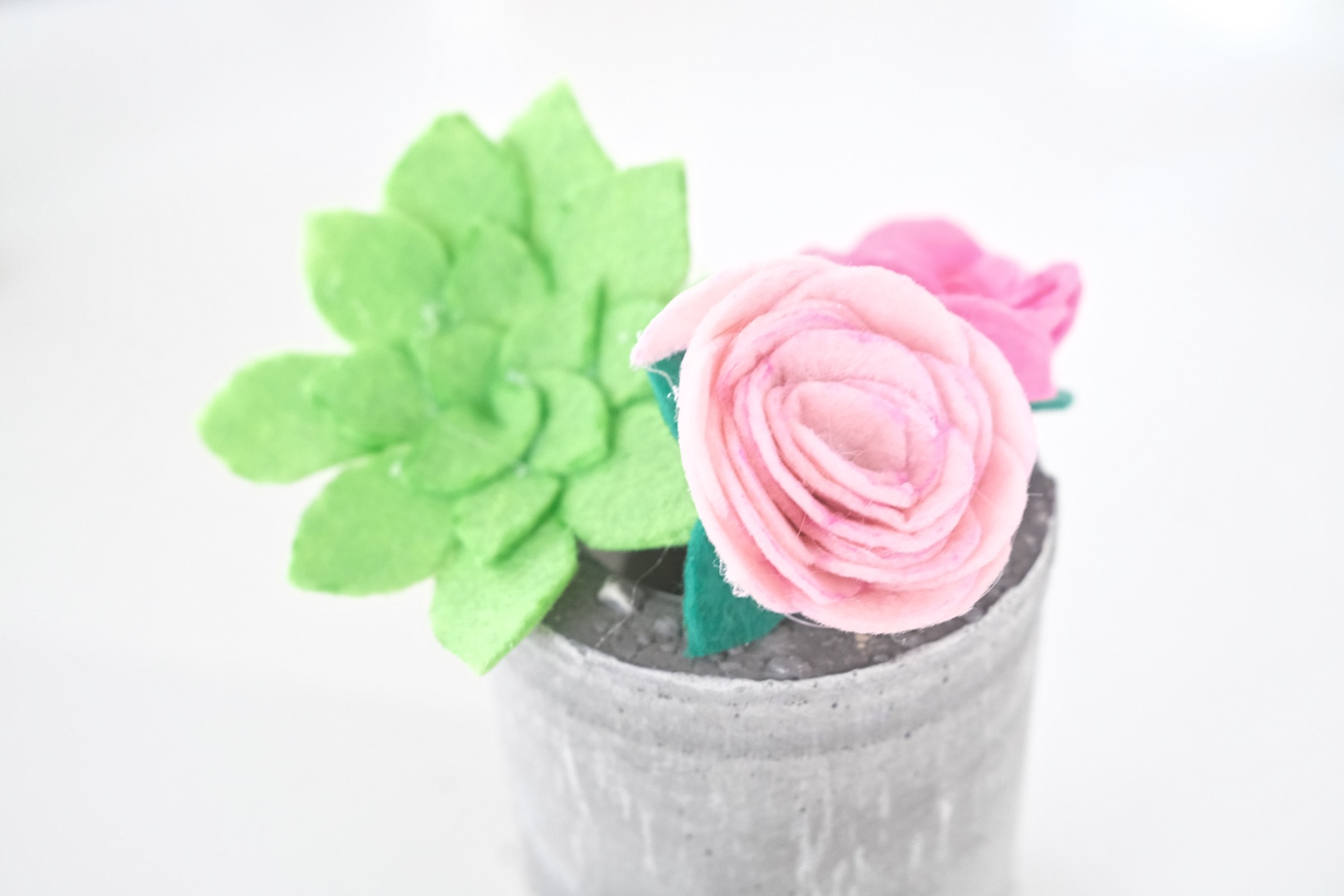 close up of finished flowers and succulents in felt