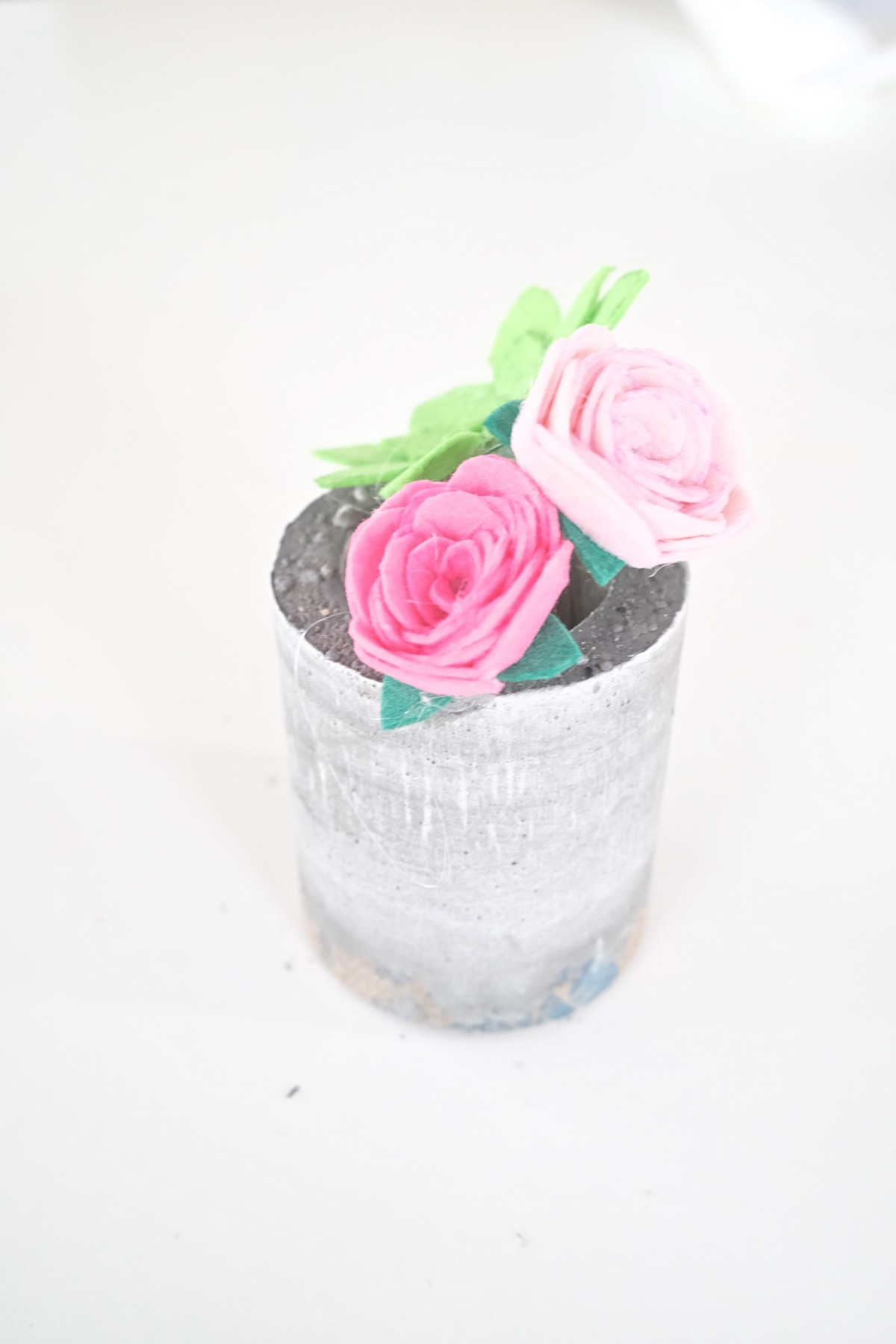finished concrete planter with felt flowers