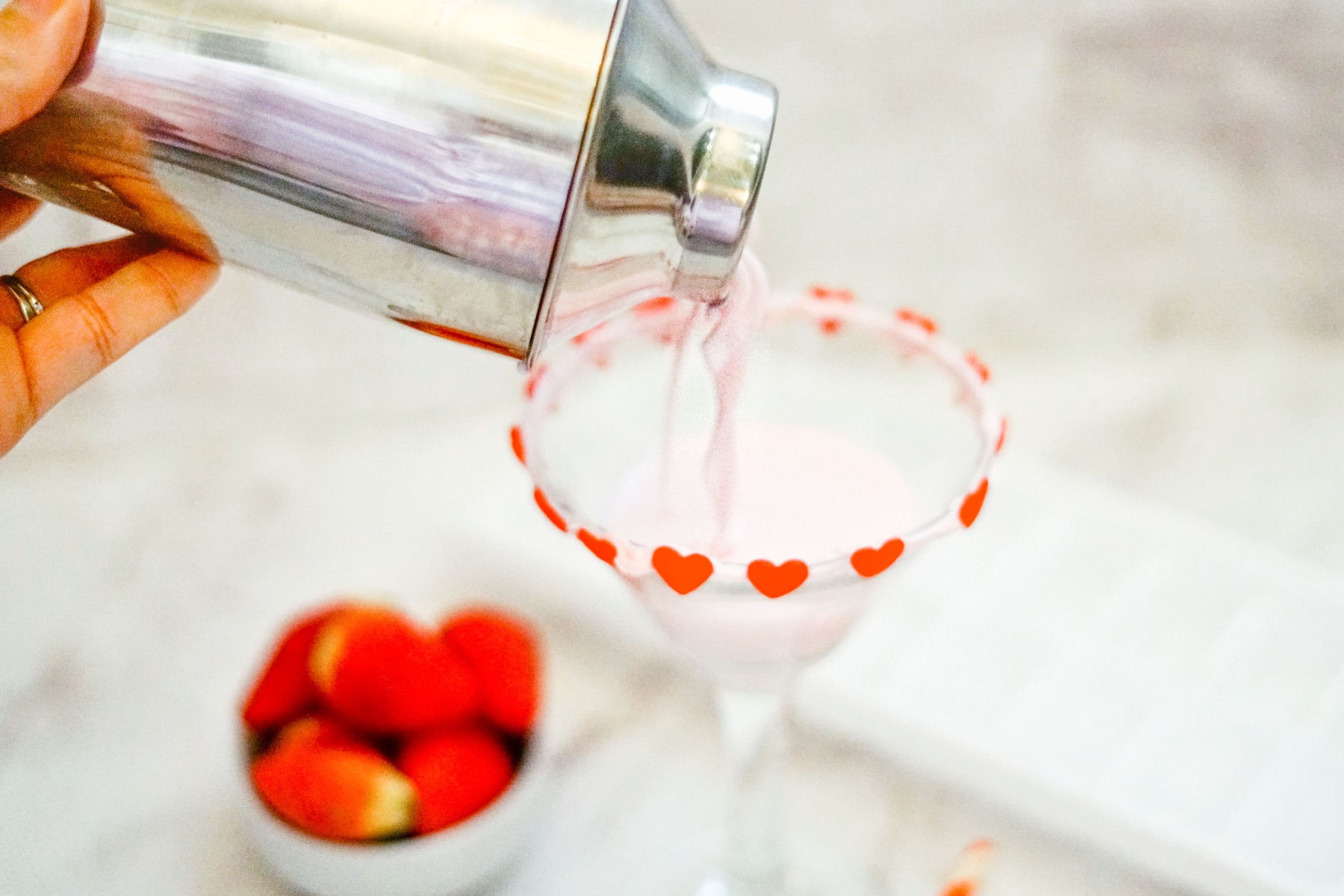 pour the from the cocktail shaker into the martini glass