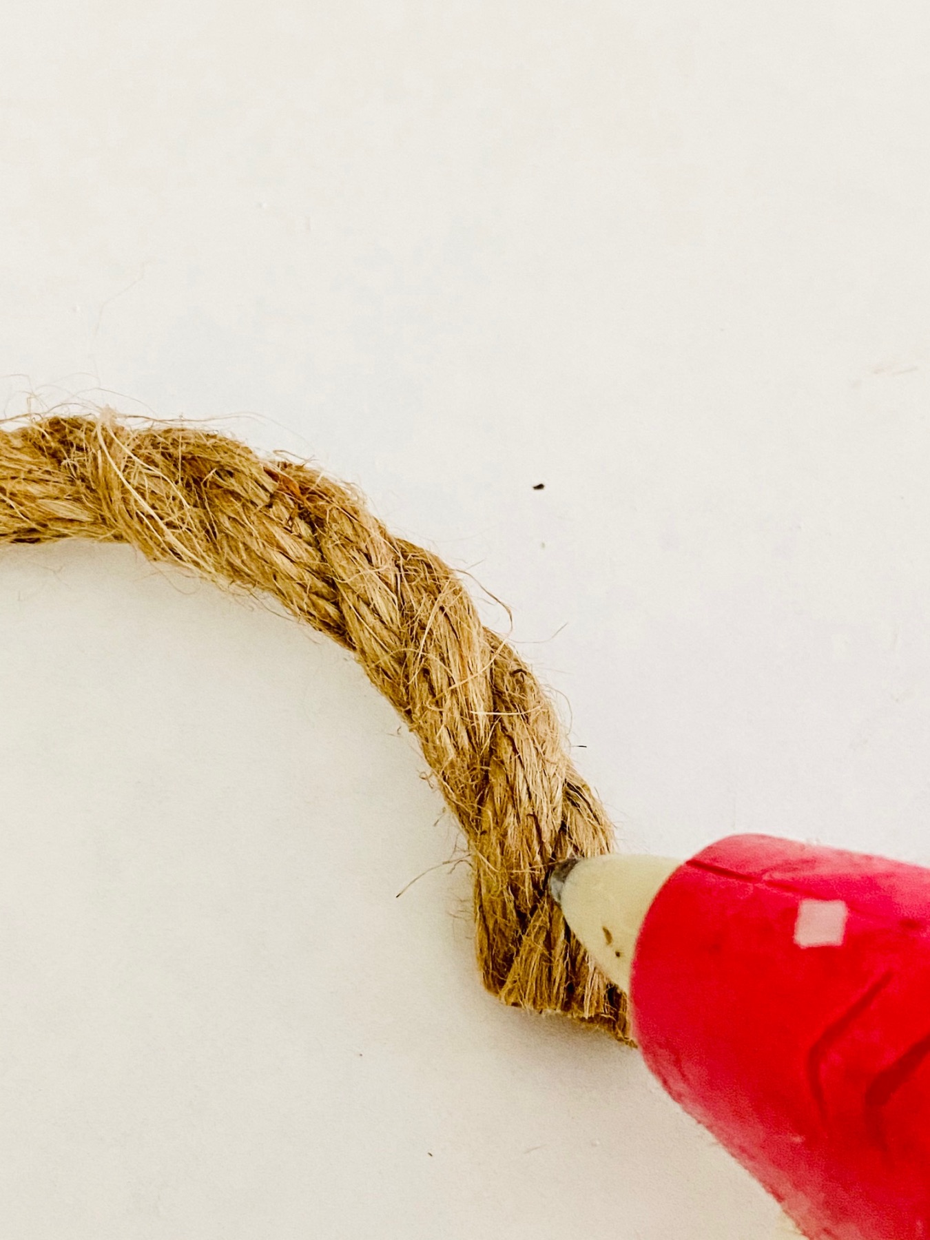use a hot glue gun to connect the rope