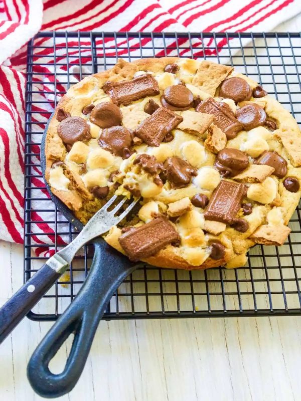 A-fresh-baked-Smore-Pizookie-Skillet-Cookies-with-a-fork-in-it