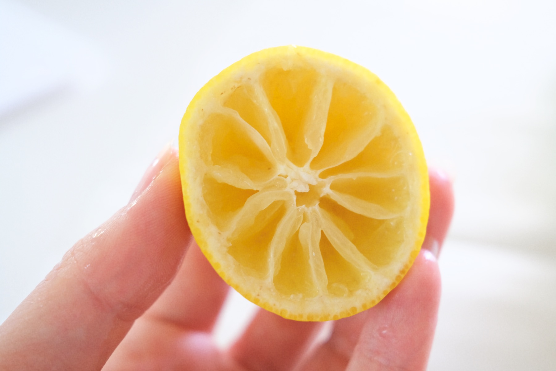 cut the pulp out of the lemon to make a stamp