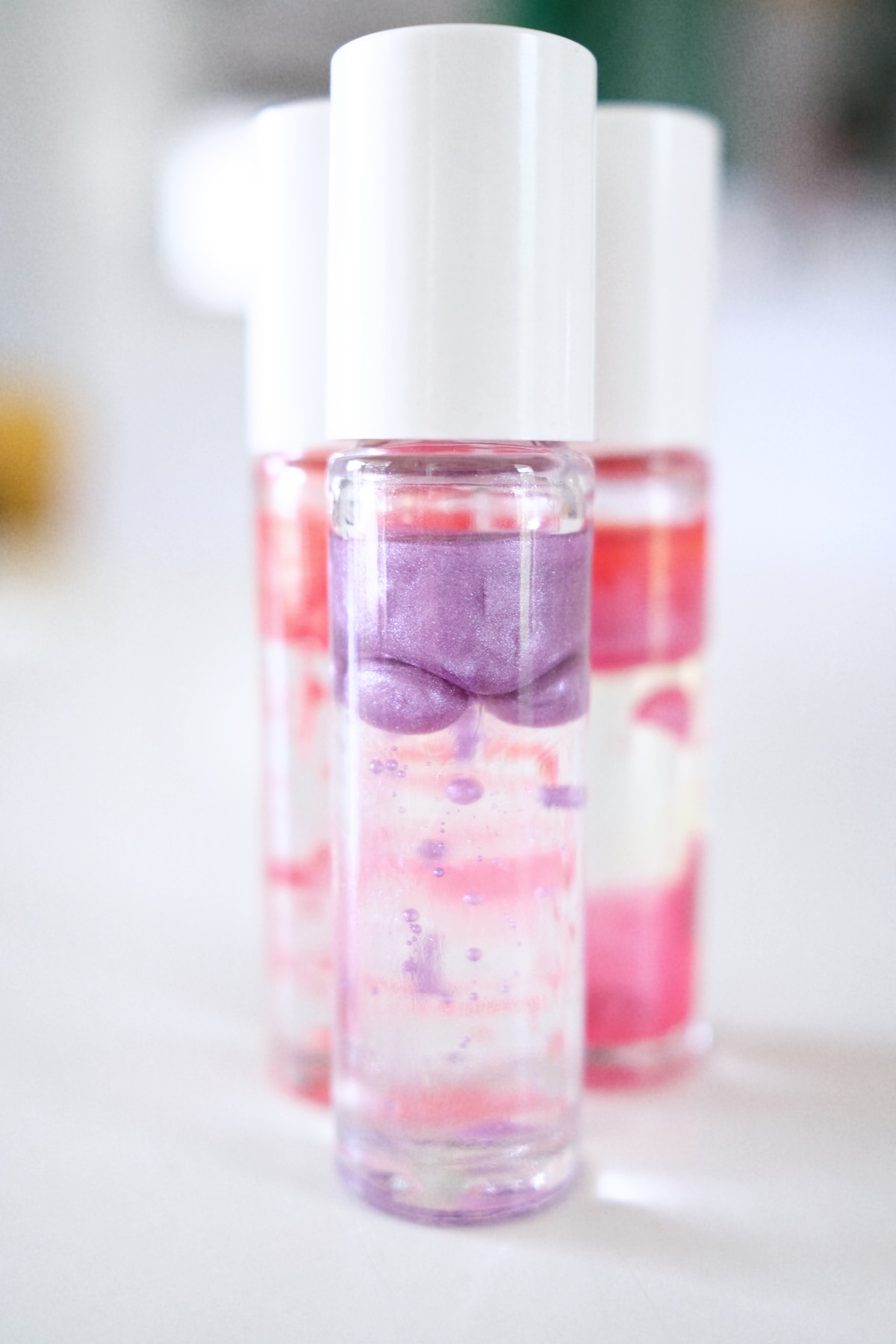 This DIY lip gloss kit makes 8 homemade lava lip glosses that produce a  unique lava lamp effect. Kids will love its shine and bubblin…