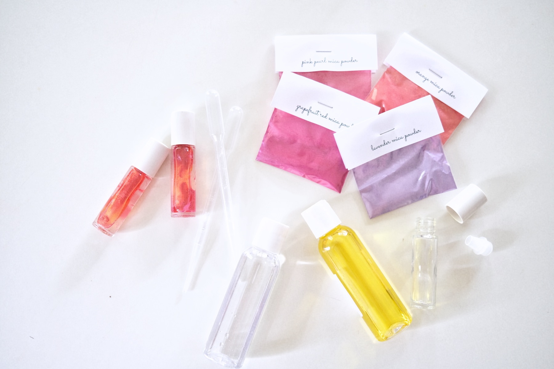 This DIY lip gloss kit makes 8 homemade lava lip glosses that produce a  unique lava lamp effect. Kids will love its shine and bubblin…