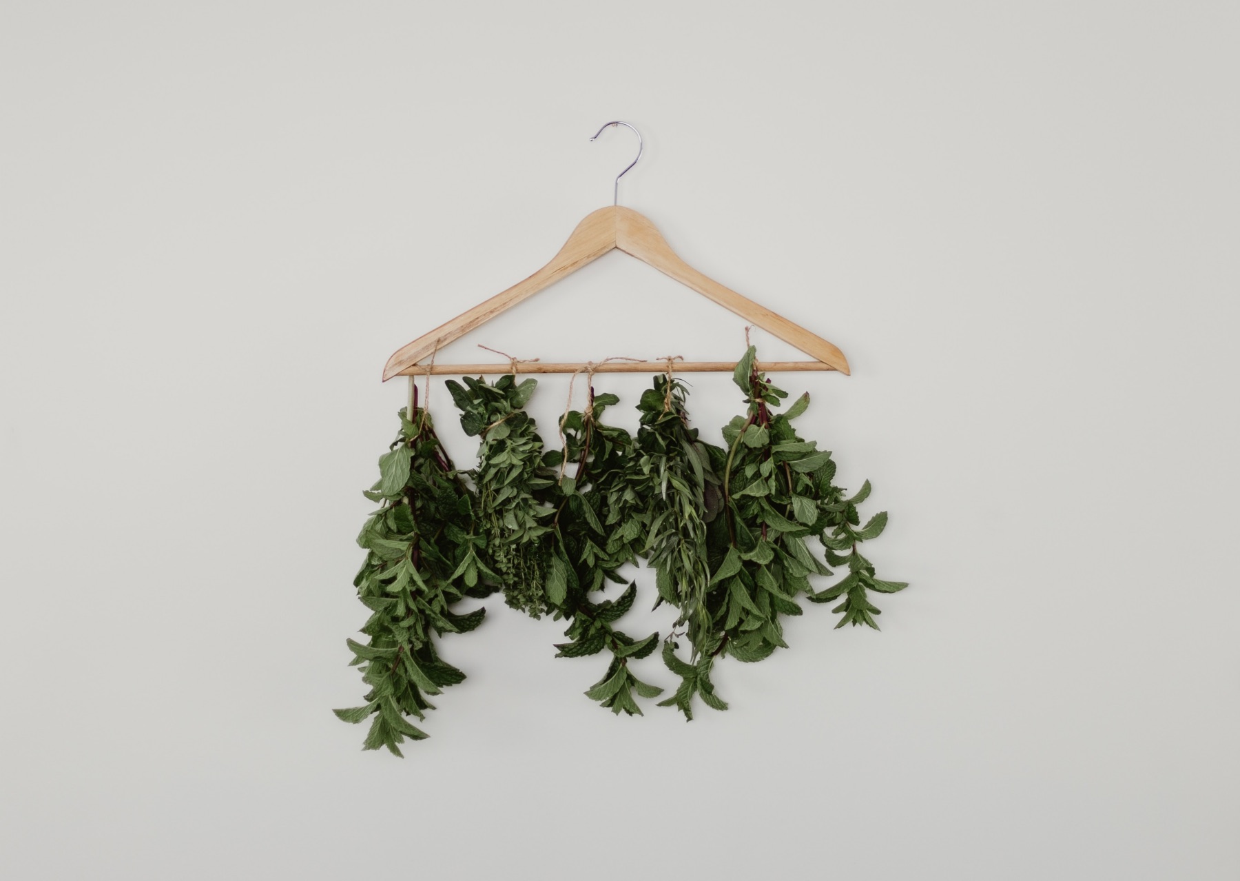 tie the fresh herbs with string to the hanger